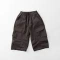 Detailed flat lay of charcoal grey cargo pants featuring elastic waist and large side pockets - Retro Coffee / 80cm