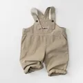 Detail of khaki kids overalls featuring Luck! patch and high-quality cotton texture - 80 / Apricot
