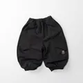 Close-up of dark grey kids joggers showing elastic waistband and knitted texture - Dark Gray / 80cm