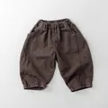 Detailed view of the elastic waistband and diagonal twill texture on kids' retro casual pants - 80cm / Mocha