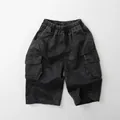Close-up of children's washed dark grey denim cargo shorts with elastic waist and large pockets - Dark Gray / 80cm