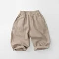 Close-up of kids linen vertical striped trousers with elastic waistband and rolled cuffs - Light Khaki / 80cm