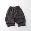 Detail view of kids linen striped pants with elastic waistband and functional pockets - Charcoal Grey / 80cm
