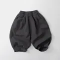 Detail view of dark grey textured cotton linen wide-leg pants for kids with elastic cuffs - 80cm / Dark Gray