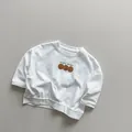 Dettaglio felpa bianca in cotone per bambini con motivo happy smile stampato - 120cm / Bianco