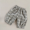 Dettaglio dei pantaloni a lanterna per bambini in lino con motivi geometrici - Pantaloni Beige a 7 Punti / 80cm