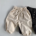 Detailed view of elastic waistband and cotton fabric texture on kids casual joggers - 80cm / Beige