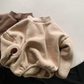 Close-up of thick sherpa fleece lining and ribbed neck detail on children's winter sweater - Beige Apricot