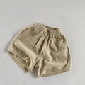 Detailed close-up of breathable linen cotton kids shorts featuring elastic waist and side pockets - 80 / Light Khaki