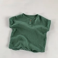 Detailed macro view of breathable double-layer cotton gauze baby romper fabric in dark green - Green / 80cm