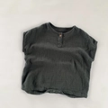 Close-up of baby romper with wood button, double gauze cotton, and snap closures - Dark Gray / 80cm