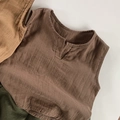 Flat lay of breathable cotton sleeveless vests in earthy tones for children fashion - 80cm / Purple and Coffee