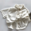 Close-up of lightweight cotton linen short sleeve kids shirt with wooden buttons - 80cm / Off-white