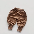 Detail of children's coffee cotton pants featuring elastic waist and ribbed leg cuffs - 80 / Turmeric