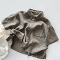 Close-up of summer kid's shirt showing olive green linen fabric and wood buttons - 80cm / Light Gray