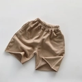 Detalle de textura de algodón French Terry caqui en pantalones cortos casuales para niños con elástico - 80cm / Café Claro