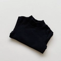 Detail view of children's black mock neck sweater with fine knit texture and soft fabric - Black / 80cm