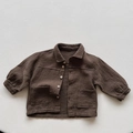 Detail shot of the natural texture and wooden buttons on a dark brown cotton jacket - 80cm / Brown