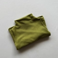Detail view of olive green velvet turtleneck shirt showing soft brushed fabric texture - Grass Green / 80cm