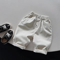Detalle de pantalones de forro polar para niños en crema con cintura elástica y bajo doblado - Blanco lechoso / 80