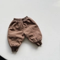 Detail of dark brown thermal kids trousers showing elastic waist and ribbed leg cuffs - Dark Coffee / 80cm
