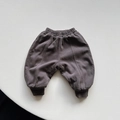Close-up of winter children's thick warm fleece pants in dark grey-brown with ribbed cuffs - Dark Gray / 80cm