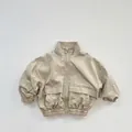 Detail view of khaki windproof jacket featuring a stand collar and elastic cuffs - Khaki / 80cm