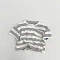 Detail of children's striped cotton t-shirt featuring a chest pocket and soft neckline - 80cm / Beige Apricot