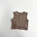 Detail view of cotton knit toddler vest with brown color and wood-style buttons - 80cm / Brown