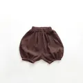 Close-up of deep brown baby bloomers featuring soft wrinkled cotton gauze fabric texture - 80cm / Dark Coffee