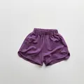 Detail of purple cotton shorts for kids showing breathable texture and elastic waist - Purple / 100cm