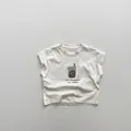 Close-up of kids cotton tank top featuring a soft cream fabric and ice cream print - Apricot / 80cm