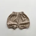 Detail view of khaki children tie-dye bloomers with elastic waist and vertical texture - 80cm / Khaki