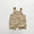 Detailed view of khaki linen baby overalls featuring durable straps and chest pocket - 80cm / Khaki