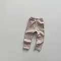 Detail view of neutral striped cotton knit leggings with an elastic waistband for toddlers - 80 / Beige Brown Striped