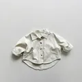 Detail of beige children cotton shirt showing workwear pockets and premium canvas texture - 80cm / Beige Apricot