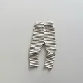 Detailed view of striped cotton baby leggings with comfortable elastic waistband - 80 / Beige and Black Stripes