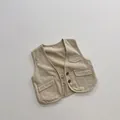 Detailed view of kids khaki cotton twill vest with two utility pockets and button closure - 80cm / Khaki