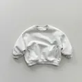 Detail view of children's grey marl fleece sweatshirt with ribbed cuffs and side pockets - Light Grey