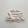 Detail of cream sweatshirt showing ribbed collar and Dad < mom print for kids - 80cm / Apricot