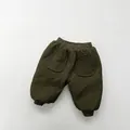 Detail of olive green quilted kids pants featuring vertical texture and ribbed cuffs - 80 / Army Green
