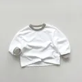 Detail of soft cotton long sleeve shirt showing grey ribbed neckline and cuffs finish - 80cm / White