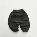 Detailed back view of children's grey knit joggers featuring dual curved pockets - 80cm / Dark Grey Green