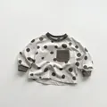 Detailed close-up of dot pattern fabric and ribbed cuffs on kids long sleeve tee - 80cm / Grey-Beige