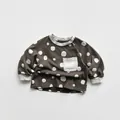 Close-up of kids polka dot sweatshirt with rib cuffs and contrast pocket detail - 80cm / Grey Brown
