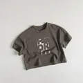 Détail à plat du t-shirt pour enfants en coton avec imprimé OR gris anthracite - Gris Café / 80cm