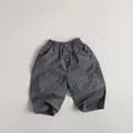 Detail of kids casual cotton pants featuring elastic waist and decorative buttons - Dusty Blue / 80cm