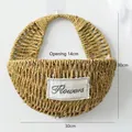 Detail view of handmade straw wall basket with flowers patch and 30cm dimension markers - Full Woven Large