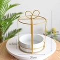 Detail view of 26cm golden iron cake-shaped flower basket with white tray and heart handle - Round Birdcage Style / Gold