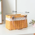 Close-up of a woven basket with white lace trim and leather handles for storage - Rectangular Wood Chip Basket With Lace